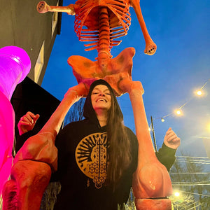 atma devi poses with her ss swag and a giant skeleton